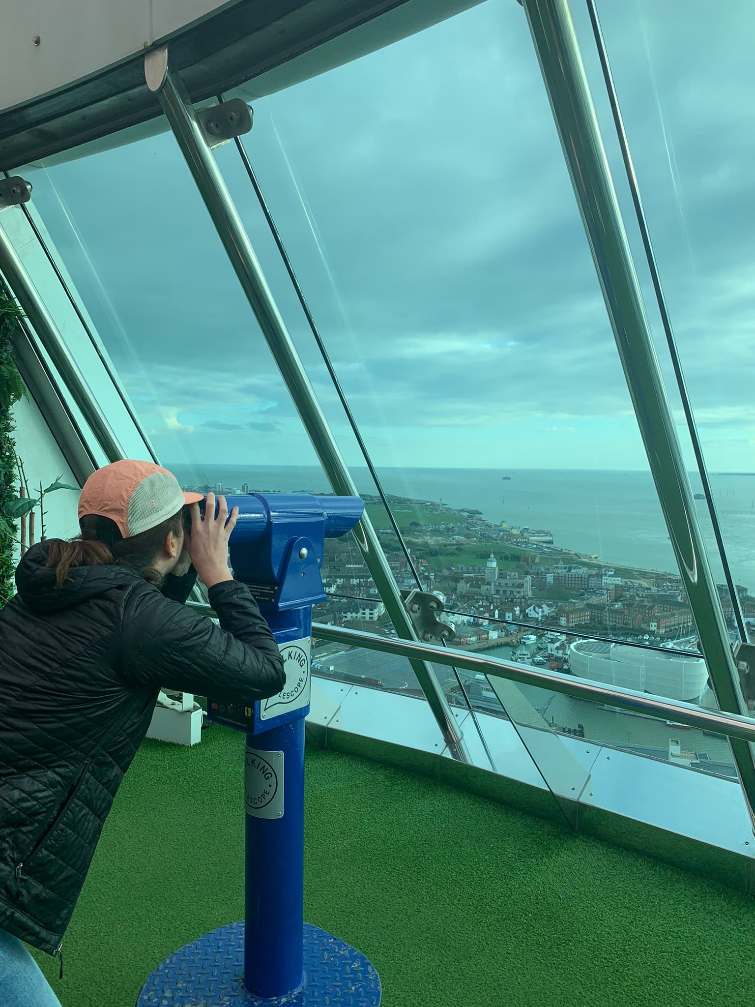 Rosina looking over the city through a telescope